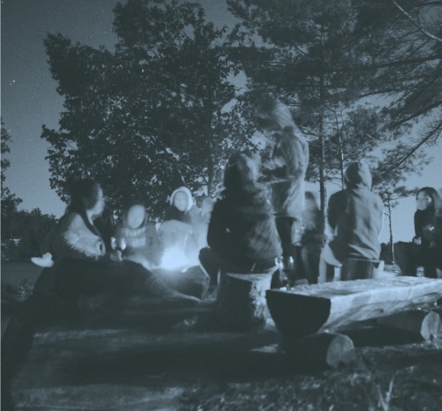 people around campfire